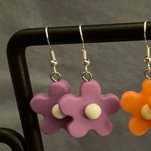 Purple rubber flower earrings.
